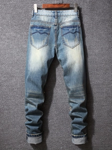 Men's retro blue washed slim fit denim jeans featuring vintage back pocket embroidery