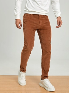 Men's slim fit corduroy pants in brown featuring classic vertical ribbed texture design