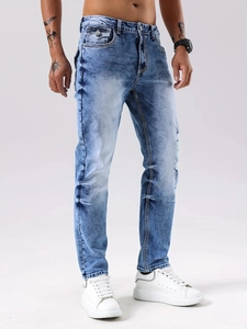 Men's slim fit light blue washed denim jeans with white contrast stitching and flap pockets