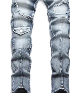 Men's slim fit distressed blue cargo jeans with heavy ripped details and utility pockets