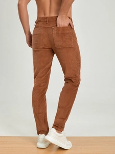 Men's caramel corduroy casual trousers with back pockets shown from a rear view