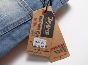 Detail of light blue denim fabric texture and clothing tag with style number 808