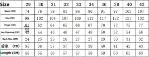 Detailed size chart for men's hip-hop style ripped denim shorts with splattered paint design