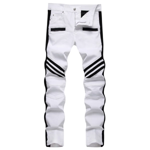 Detail of white biker jeans with black side stripes and pleated knee patchwork detail