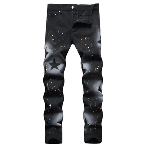 Men's slim black denim jeans with five-pointed stars and colorful paint splatter design