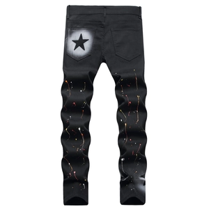 Men's black slim fit jeans with colorful paint splatters and star print on the back