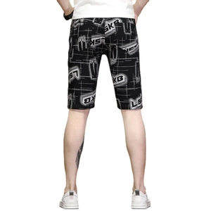 Men's slim fit black shorts with white graffiti SKB print, back view on white background