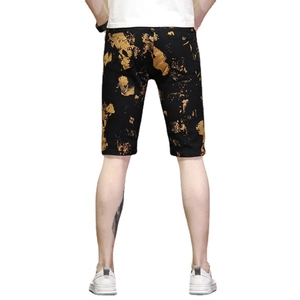 Short slim pour homme noir avec imprimé éclaboussures dorées et poches arrière