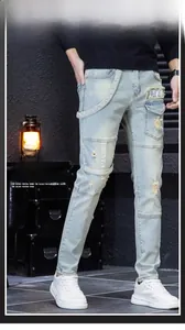 Detail of light blue slim fit jeans with heavy wash and LSKB patch pocket