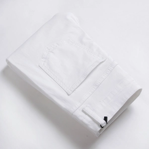 Men's slim straight white stretch denim jeans professionally folded with pocket detail