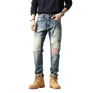 Men's slim straight jeans with vintage wash and multi-texture patchwork detailing