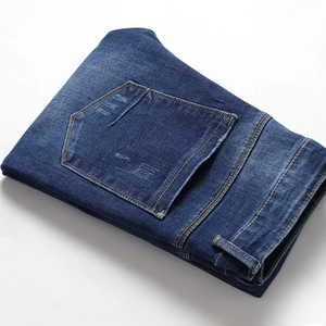 Classic blue washed men's jeans in mid-waist cotton denim with vintage stitching