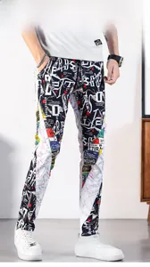 Detailed view of urban graffiti print jeans with slim fit design and vibrant pop art patterns