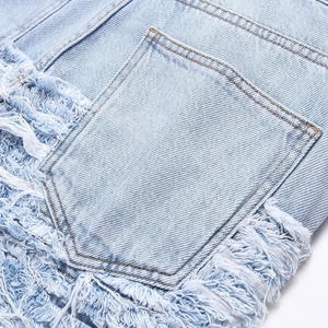 Men's loose street style light blue jeans featuring heavy distressed fringe detail