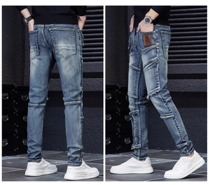 Détails du jean slim pour hommes avec empiècements usés et fermetures éclair latérales