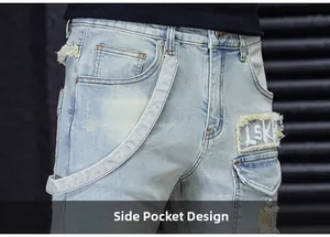 Close-up of side pocket design with frayed patch and street style straps on denim jeans