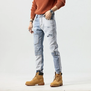 Slim fit patchwork distressed blue jeans with embroidery and motor-style ripped details