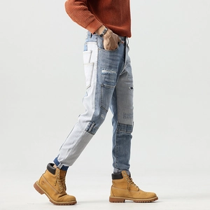 Mens patchwork slim fit jeans with distressed blue denim blocks and side pocket detail