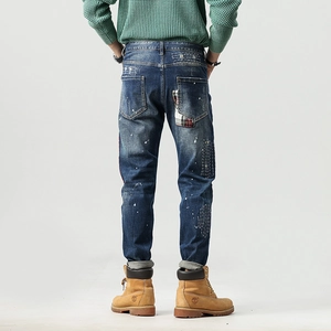 Herren Slim-Fit Patchwork-Jeans mit weißen Farbspritzern und Distressed-Details