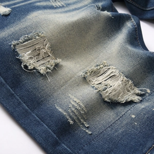 Men's vintage blue washed ripped denim shorts with distressed texture and slim straight fit