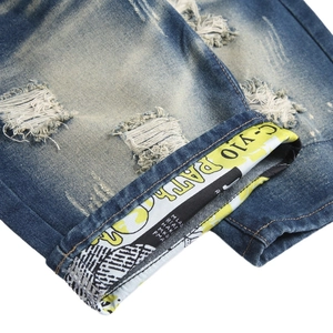 Slim fit retro washed denim shorts featuring distressed ripped holes and printed lining