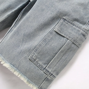Men's light blue cargo denim shorts featuring a large side pocket and trendy frayed hems