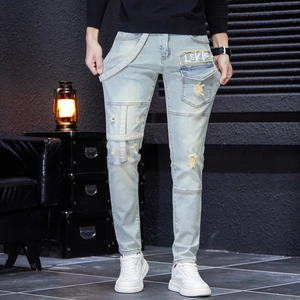 Slim fit light blue distressed jeans for men with patchwork details and stylish strap decor