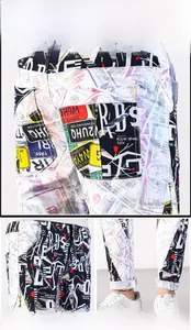 Detail of trendy graffiti print on slim fit jogger pants with creative letter patterns
