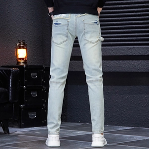 Slim fit light blue distressed men's jeans with patchwork and street graffiti print
