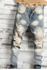 Detailed macro of vintage washed denim jeans with distressed star pattern lining detail
