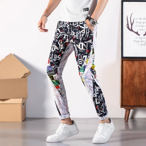 Slim fit white jeans for men featuring colorful street style graffiti and artistic patterns