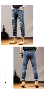 Detail of distressed denim jeans featuring unique patches and embroidered badges
