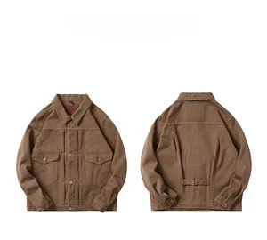 Detail view of brown canvas work jacket showing front pockets and back adjustable buckles