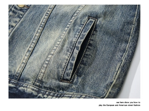 Detail of vintage blue denim jacket pocket showing high-quality wash and stitching