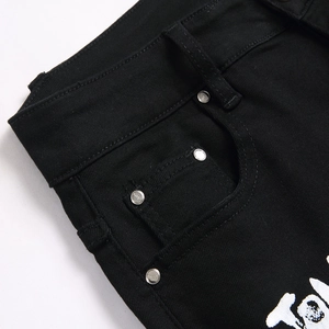 Slim fit black stretch denim jeans with white print and metal rivet details