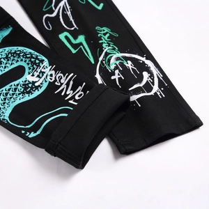 Slim fit black stretch jeans with vibrant green snake and graffiti print streetwear style