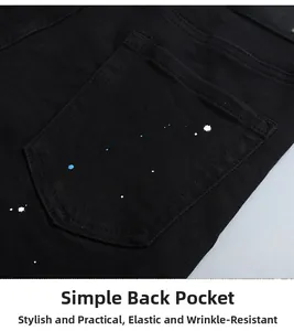 Détail de jean noir slim avec éclaboussures de peinture et design de poche arrière élastique