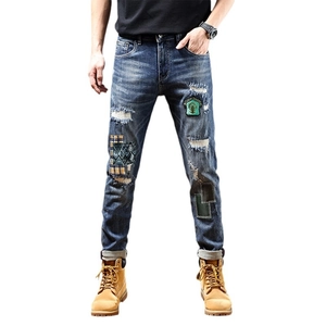 Slim fit ripped men's jeans in dark blue with unique patchwork and embroidery details