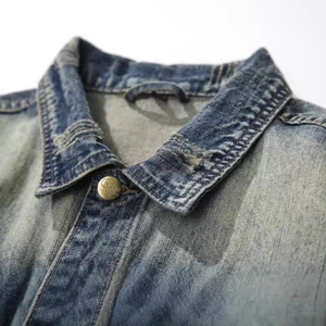 Men's vintage light blue washed denim jacket with classic collar and metal button detail