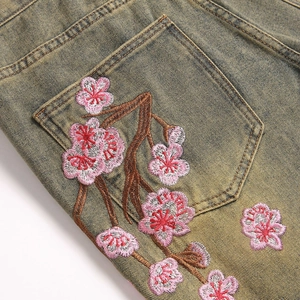 Washed vintage flare jeans for men with cherry blossom embroidery on back pocket