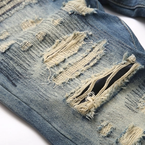 Men's punk blue slim straight jeans with heavy distressed holes and patch details