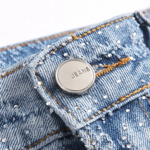 Mens high street flare jeans with rhinestones and branded metal button detail