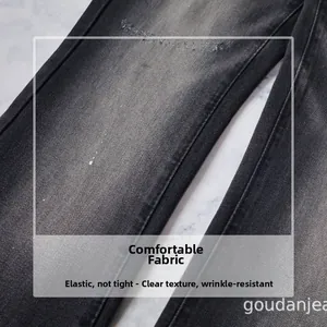 Detail of grey washed denim fabric with twill texture and stretch material quality