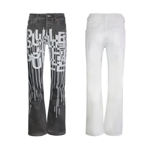Men's flared jeans featuring black splatter print and white denim pocket design