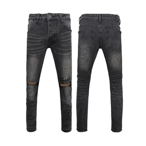 Men's charcoal grey washed denim jeans featuring distressed knee holes and street style prints