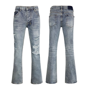 Detailed front and back view of light blue distressed flared jeans with cross embroidery
