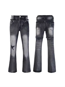Slim fit flared men's jeans in washed black with distressed ripped details and mid-waist