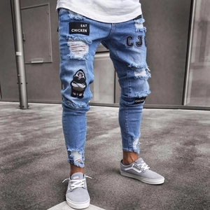 Men's slim-fit light blue distressed jeans with custom embroidery and streetwear patches