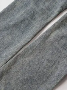Mens mid-blue washed flared jeans featuring classic denim twill texture in a loose straight fit