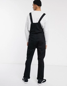 Rear view of men's black denim overalls with vertical straps and functional back pockets